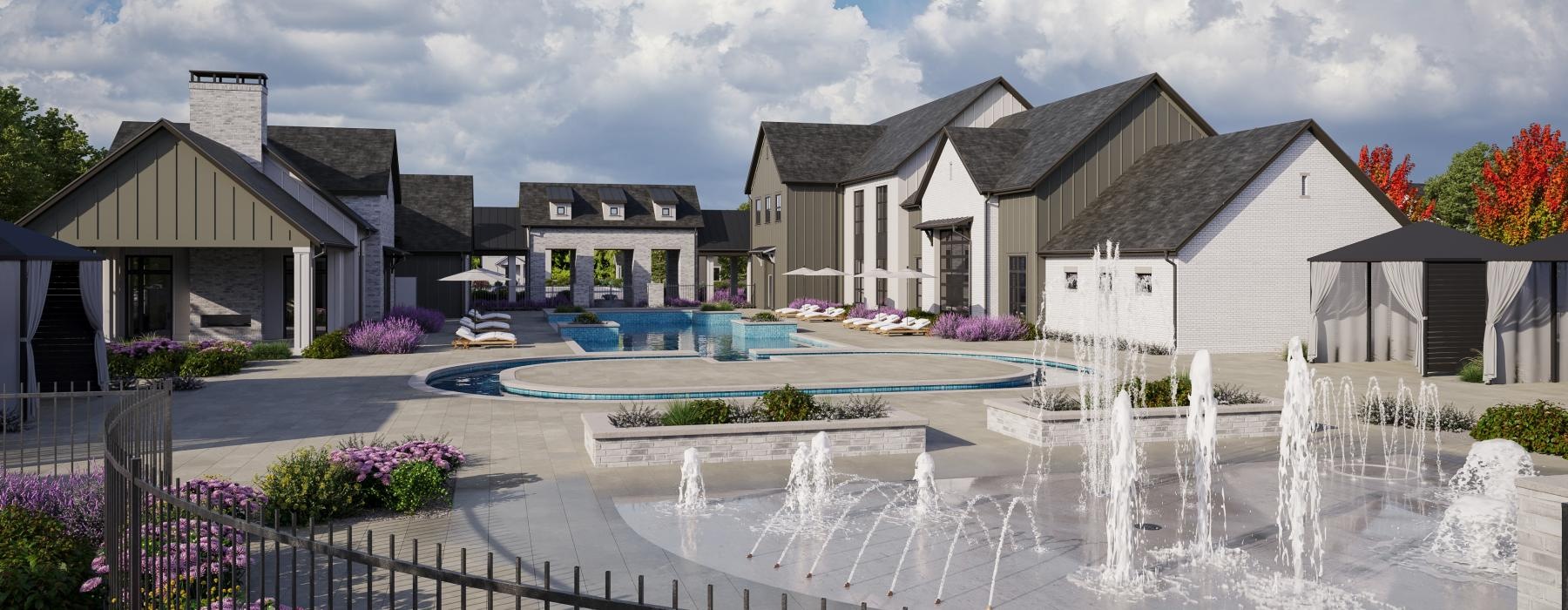 a fountain in front of a group of white buildings